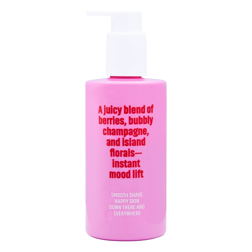 Coochy Shave Cream Berry Bliss 8 Oz in a pink bottle, featuring a blend of berries and florals for a smooth shave.