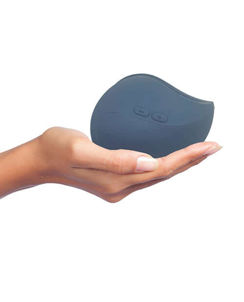 Hot Octopuss Pulse Duo Couples Massager Blue in a hand, showcasing its ergonomic design and user-friendly controls.