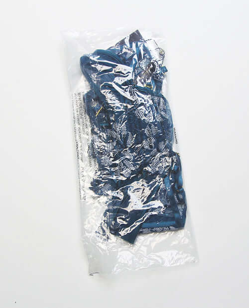 Nova Lace Teddy with Garters Jade Blue Medium packaged in clear plastic.