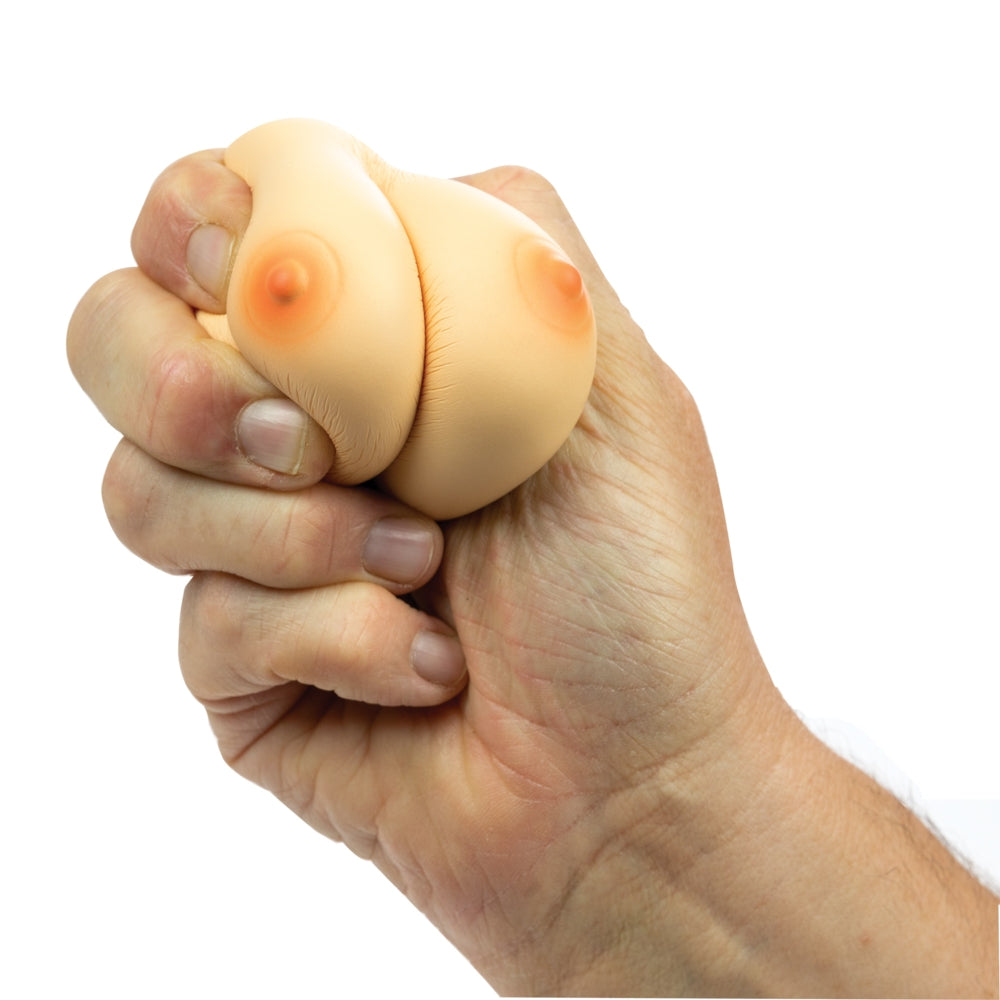 Hott Products Stress Breasts Squeeze Novelty Toy being squeezed by hand for stress relief.
