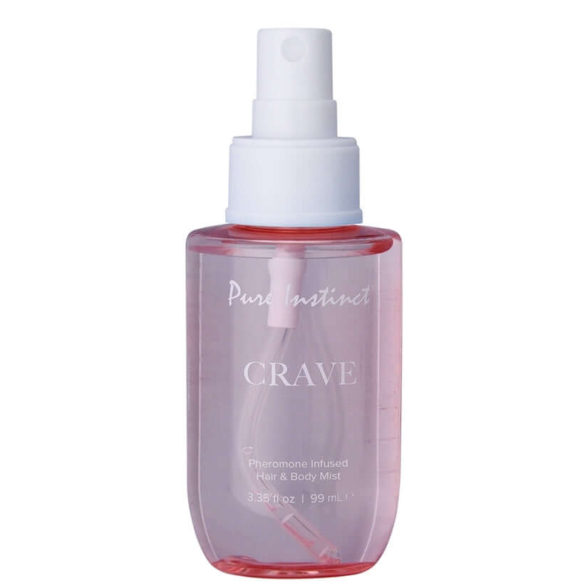 Pure Instinct Pheromone Hair & Body Mist Crave 3.35 Oz bottle in a clear design with a pink hue.