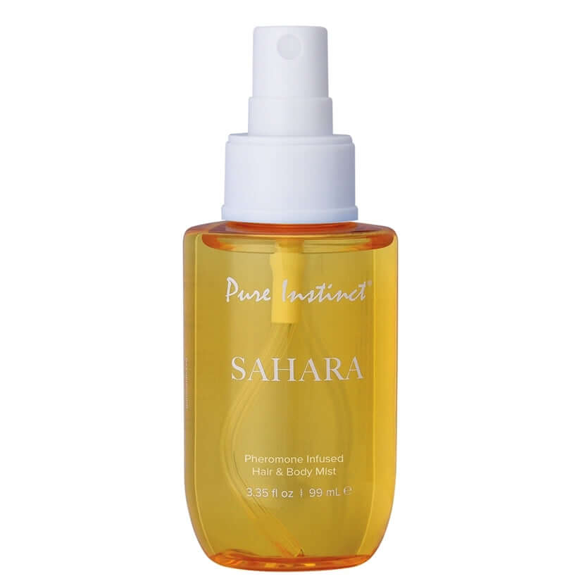 Pure Instinct Pheromone Hair & Body Mist Sahara 3.35 Oz in a spray bottle with a vibrant yellow liquid.