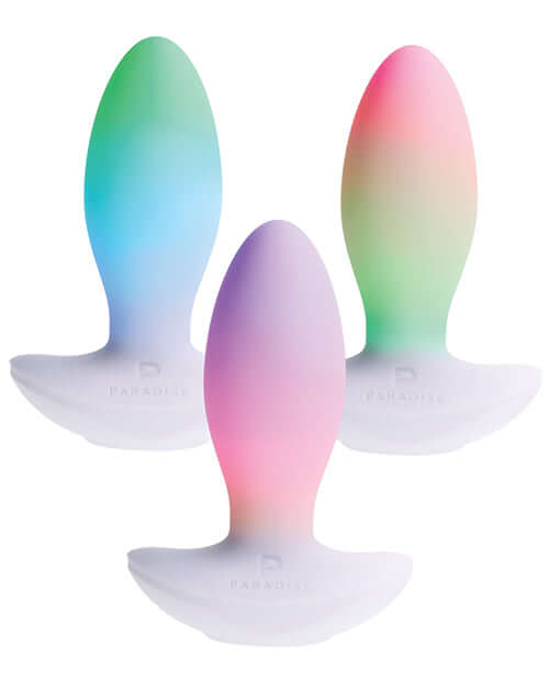 Illumination THE Plug Vibrator White, featuring a colorful design from the Paradise collection, emphasizing elegance and customization.