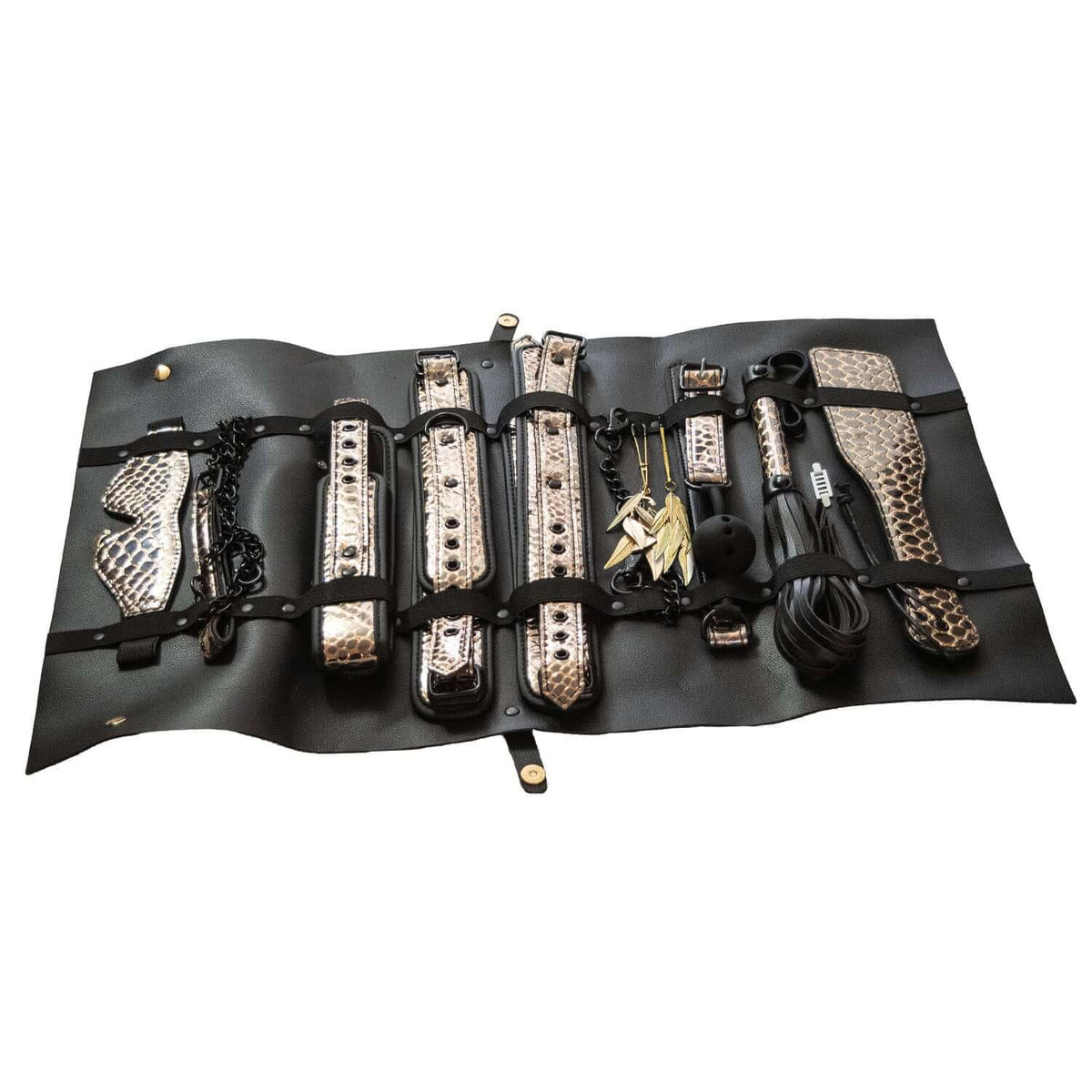 The Traveler 10 Piece Restraint and Bondage Play Kit displayed in a stylish travel case with black and rose gold designs.