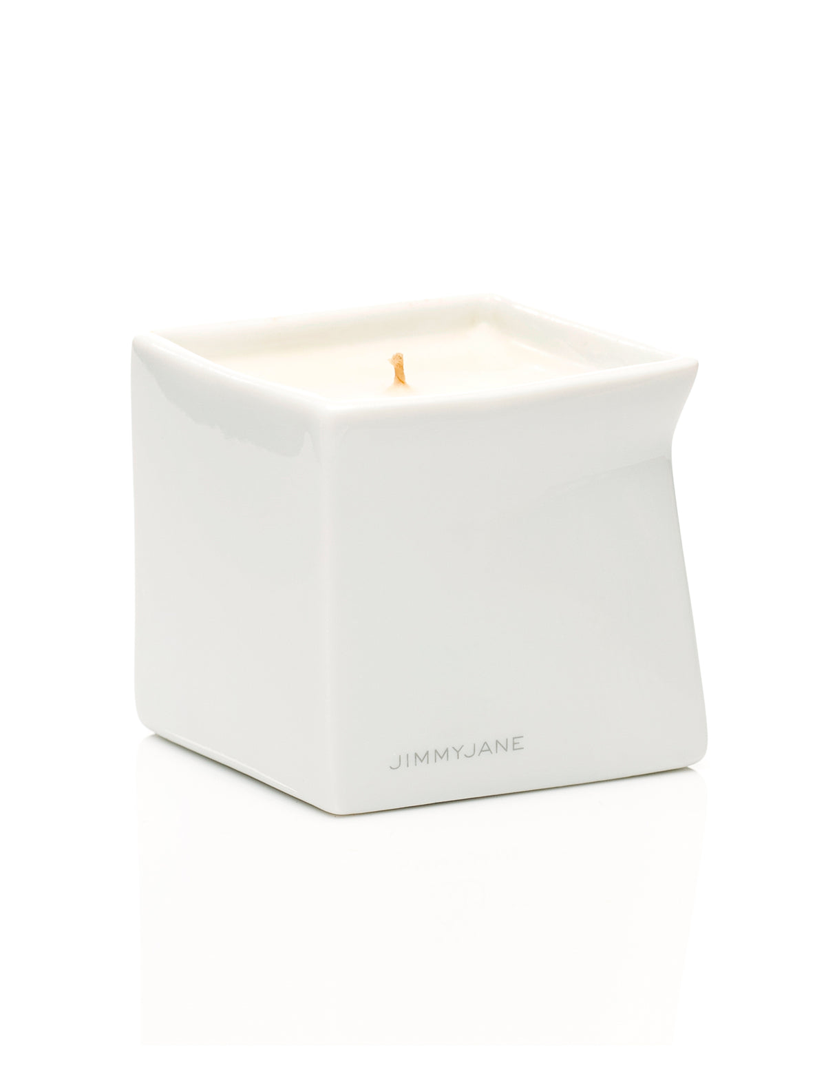 Jimmyjane Natural Massage Oil Candle 4.5 Oz Santal in a sleek white container with a wick.