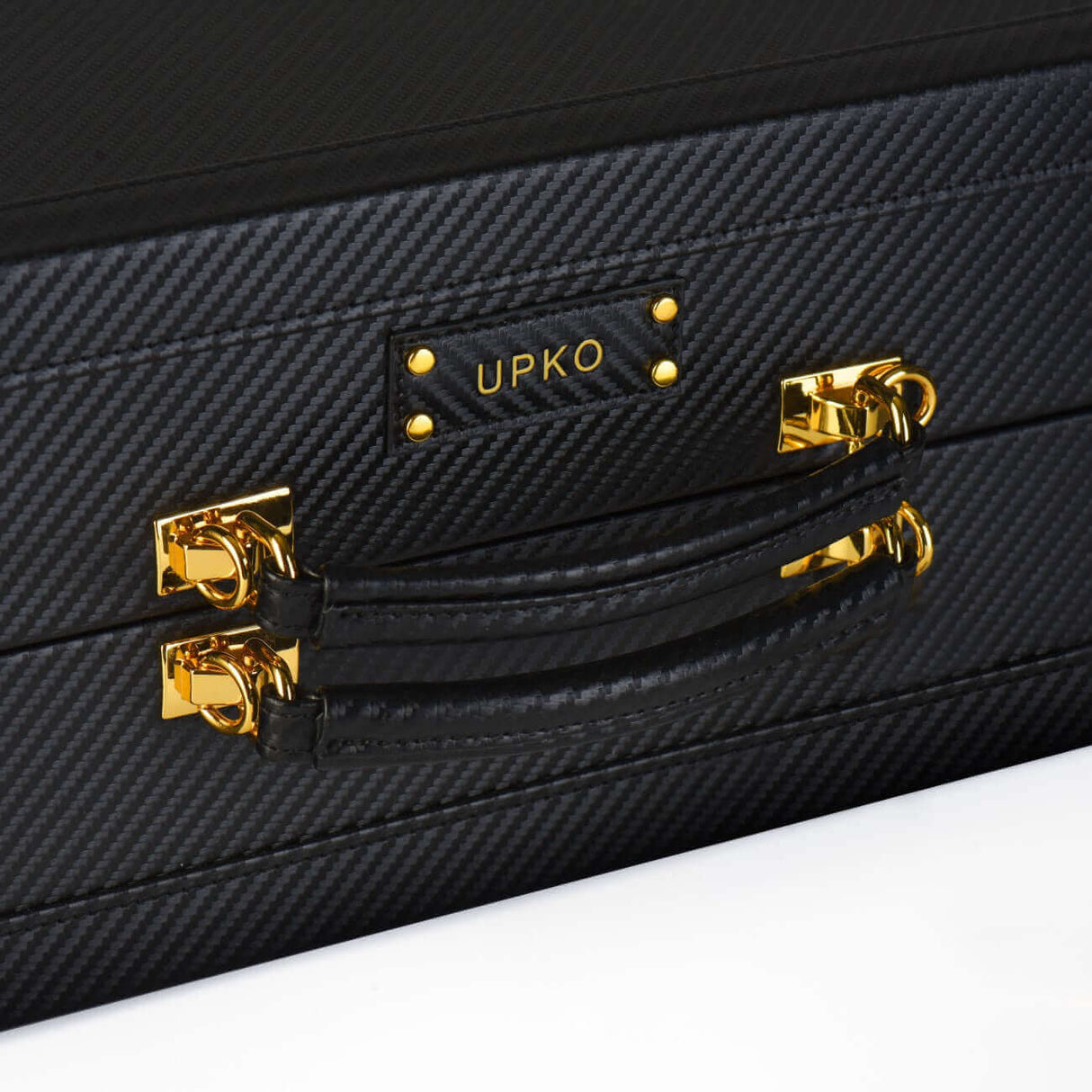 Luxury bondage trunk by UPKO with golden hardware and textured black exterior, ideal for secure BDSM storage.