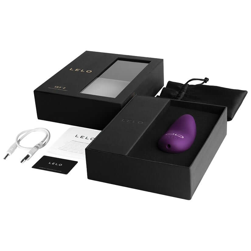 Lelo Lily 2 Personal Massager Plum packaging, accessories, and lavender massager displayed elegantly.