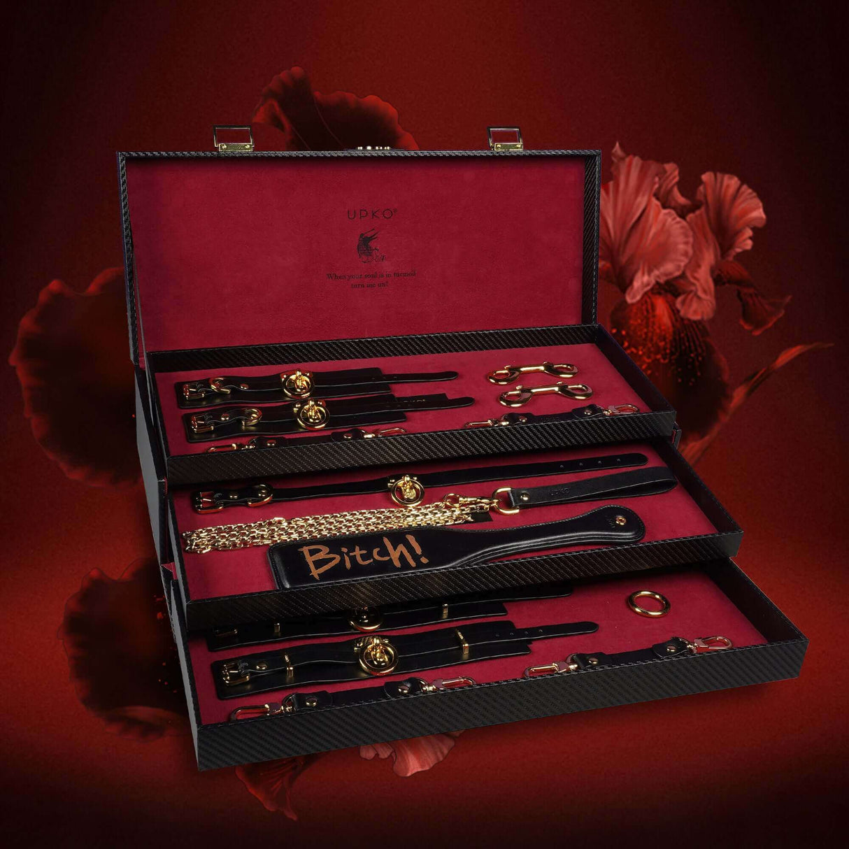 UPKO luxury Italian leather bondage tools set displayed in elegant case with accessories including collars and cuffs.