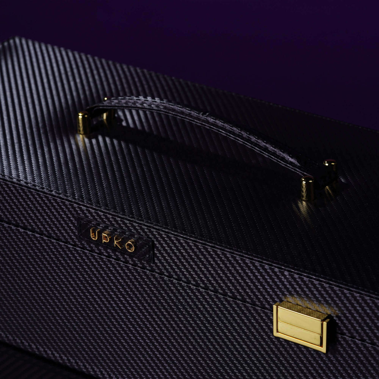 UPKO luxury bondage tools case with a textured black exterior and gold accents, perfect for BDSM accessories.