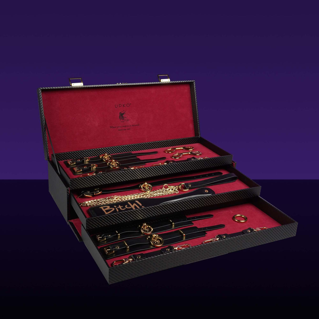 Luxury Italian leather bondage tools set in a stylish case with gold accents and red velvet lining, designed for BDSM play.
