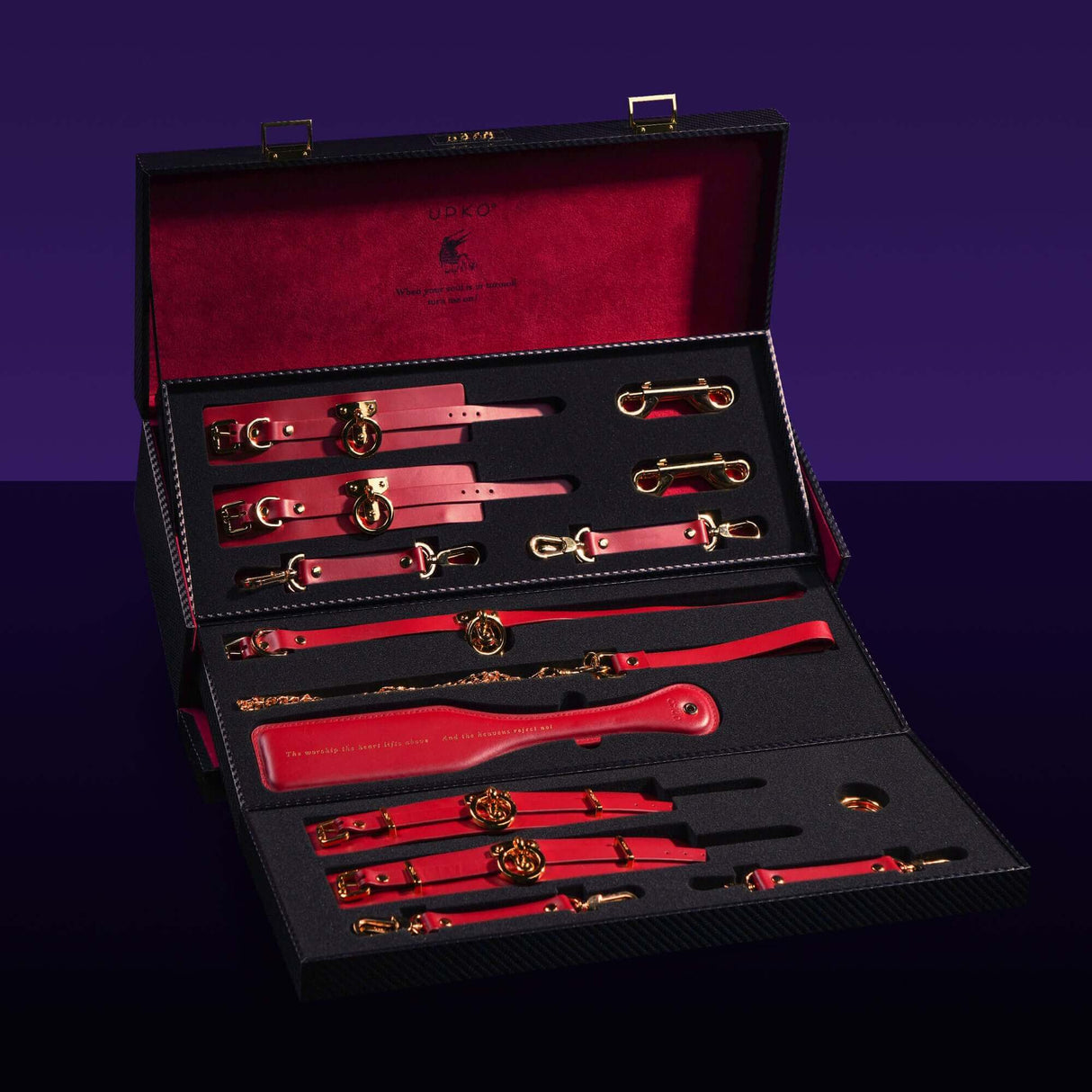 UPKO luxury Italian leather bondage tools set in red with gold accents, displayed in a stylish case for BDSM accessories.