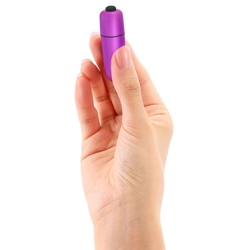 Love To Love Waouhhh Bullet Vibrator Sweet Orchid held in hand, showcasing its compact design and vibrant purple color.