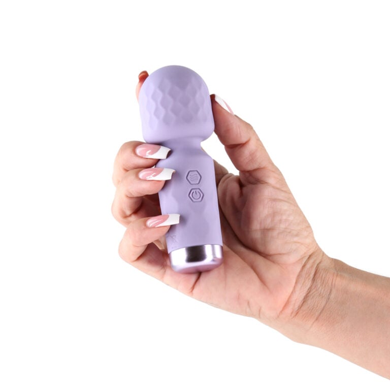 Lust N Dreams Salsa Silicone Petite Body Wand Lavender being held in hand, showcasing its compact design and buttons.