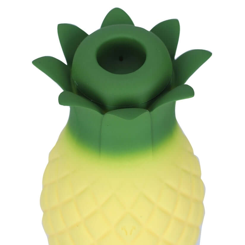 Maia Aloha Suction & Vibrating Pineapple Vibrator top view with green leaves and yellow body.