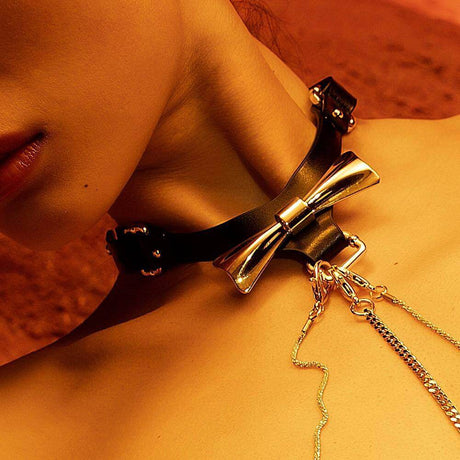 Luxurious UPKO Butterfly Effect leather choker with bow design, showcasing elegant craftsmanship and trendy style.