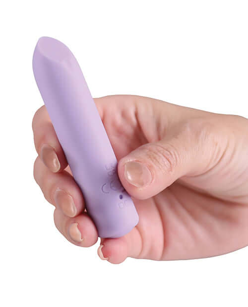 Minnies Dot Flexible Bullet Vibe Lilac held in hand showcasing its compact design and smooth silicone.