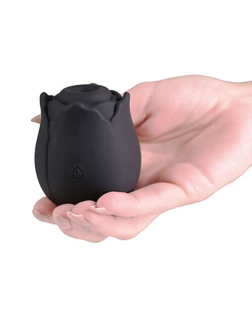 INYA The Vibrating Rose Massager Black held in a hand showcasing its sleek design and discreet shape.