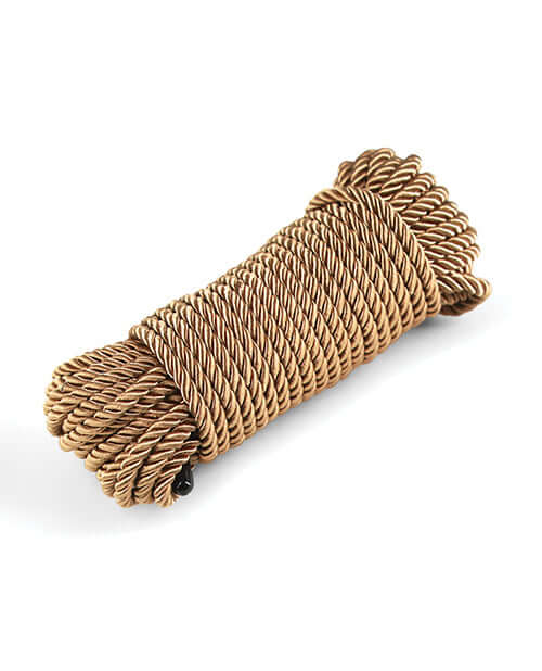 Bound 50 ft Bondage Restraints Rope Gold coiled and ready for comfortable use during bondage activities.