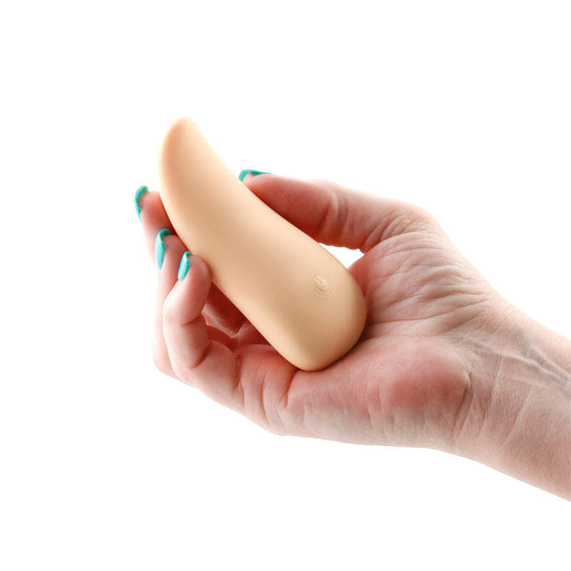 Desire Kama Vanilla Rechargeable Tongue Vibrator held in hand with a simple design for sensual stimulation.