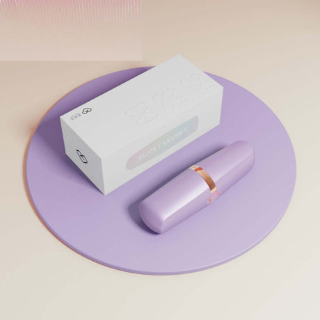 Sweet Secret Massager with clitoral suction and wand vibration on a purple tray, packaged box included
