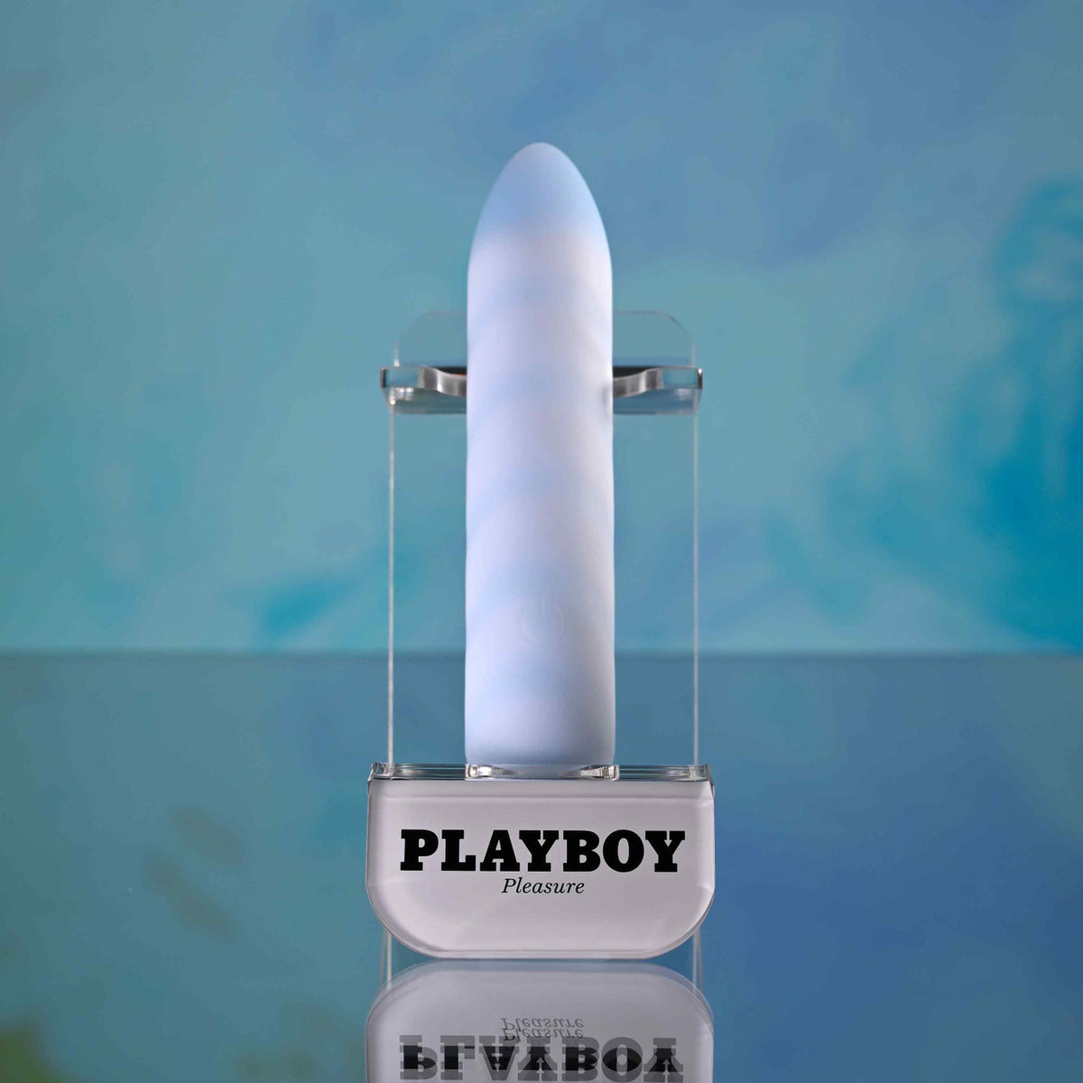 Playboy Unicorn Vibes Silicone Vibrating Bullet Blue showcased in a stylish display, perfect for enhancing pleasure.