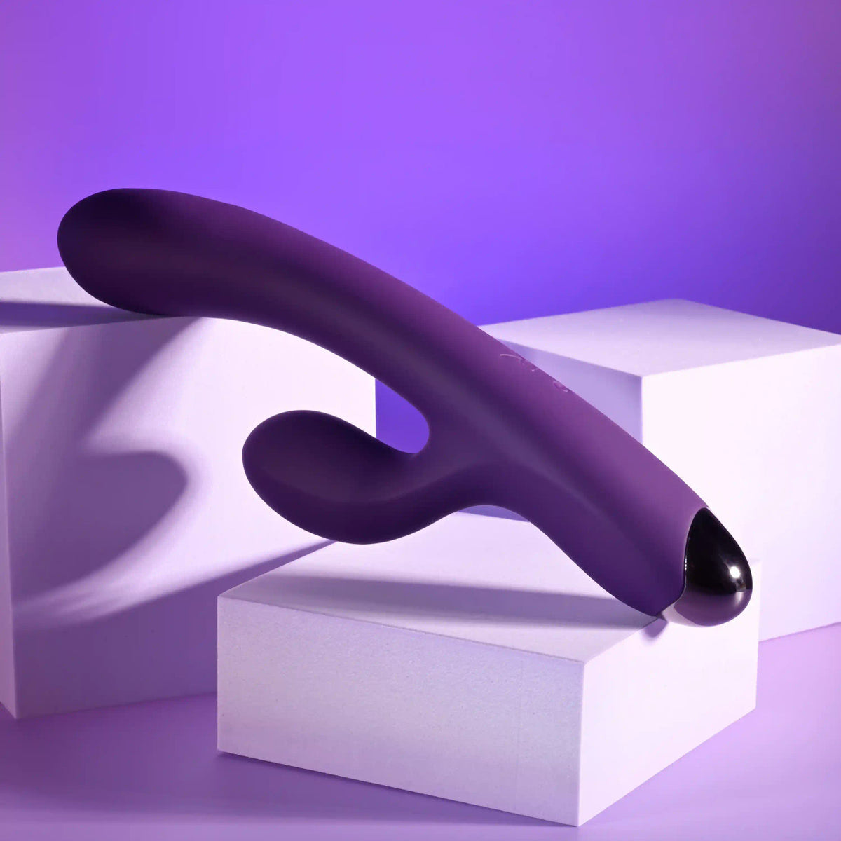 Playboy New Crush Rechargeable Dual Vibrator on display with a sleek purple design and modern aesthetic.