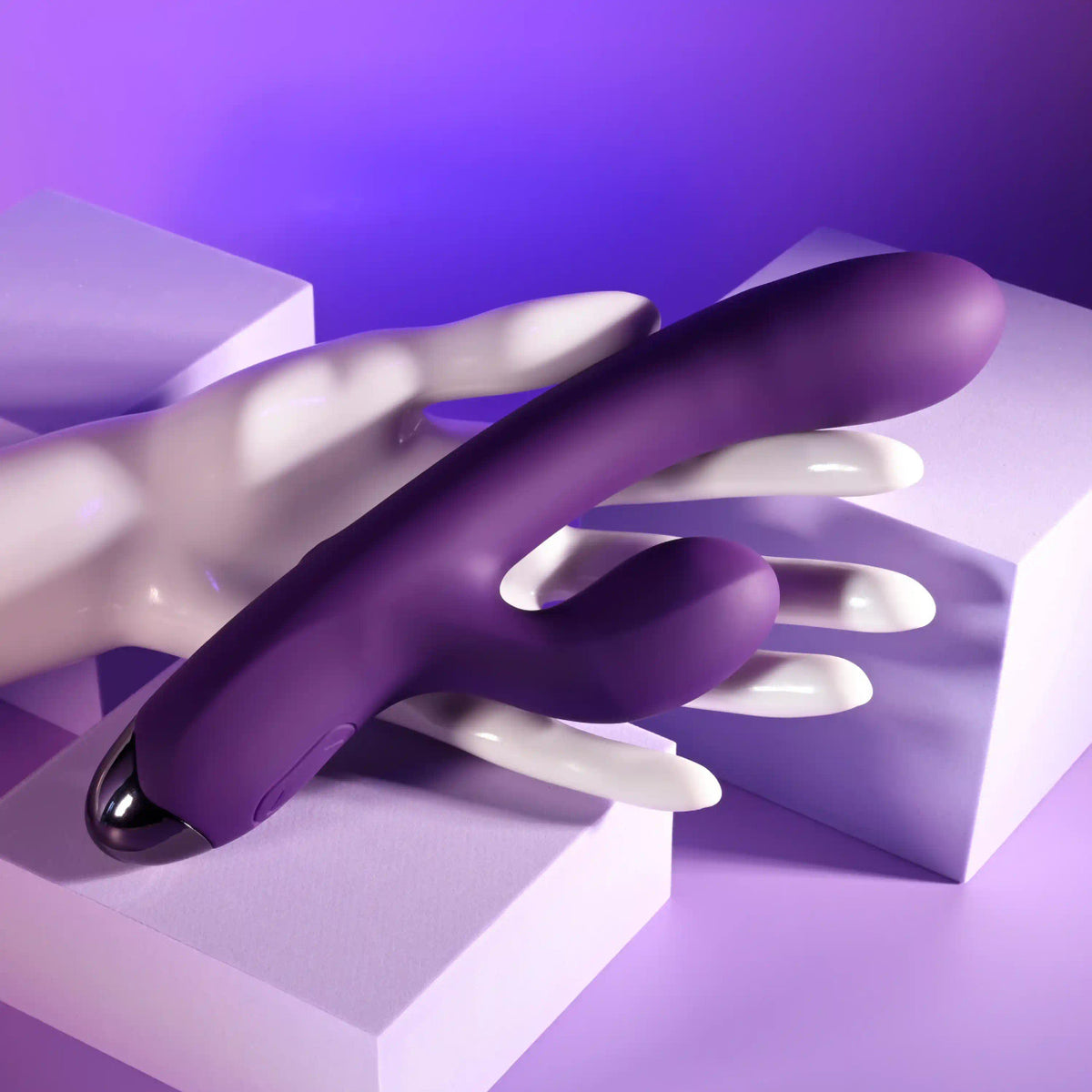 Playboy New Crush Rechargeable Dual Vibrator resting on a hand, showcasing its sleek design and dual functions.