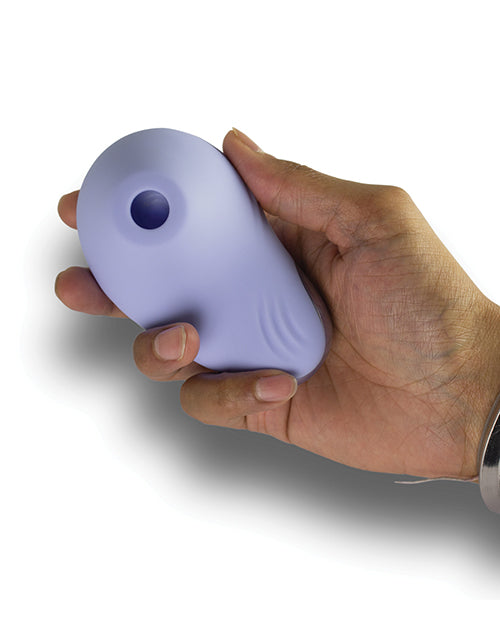 Hand holding the NIYA 6 Cornflower Air Pressure Clitoral Stimulator for intimate pleasure.