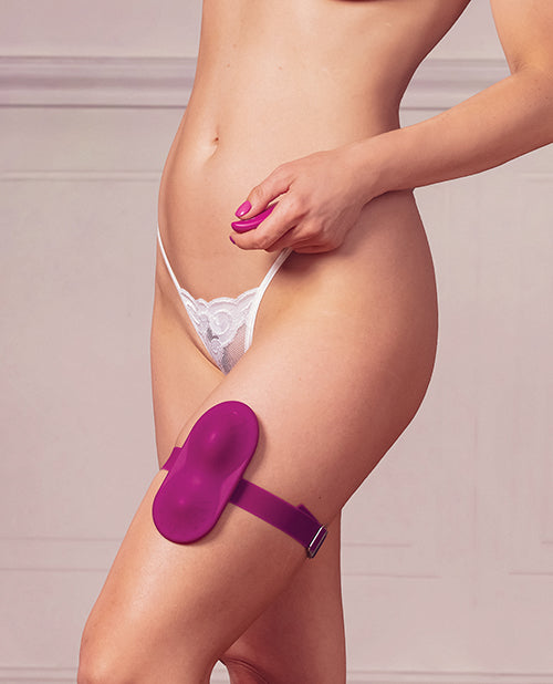 Model demonstrating the Dual Rider Remote Control Grinder Magenta attached to thigh for a hands-free experience.