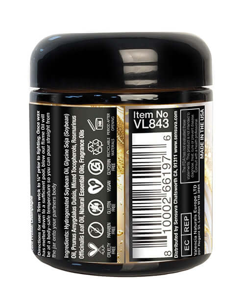 Sensuva Lit Champagne Luxury Massage Candle 4 Oz jar with ingredients and details on the label.