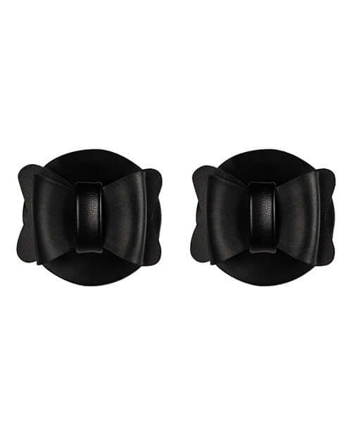Sincerely Bow Tie Pasties Black Faux Leather in a stylish bow shape on a round background.