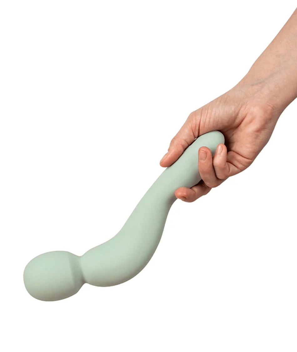 Dame Com Wand Vibrator Sage designed for comfort and effective clitoral stimulation, held in hand for demonstration.