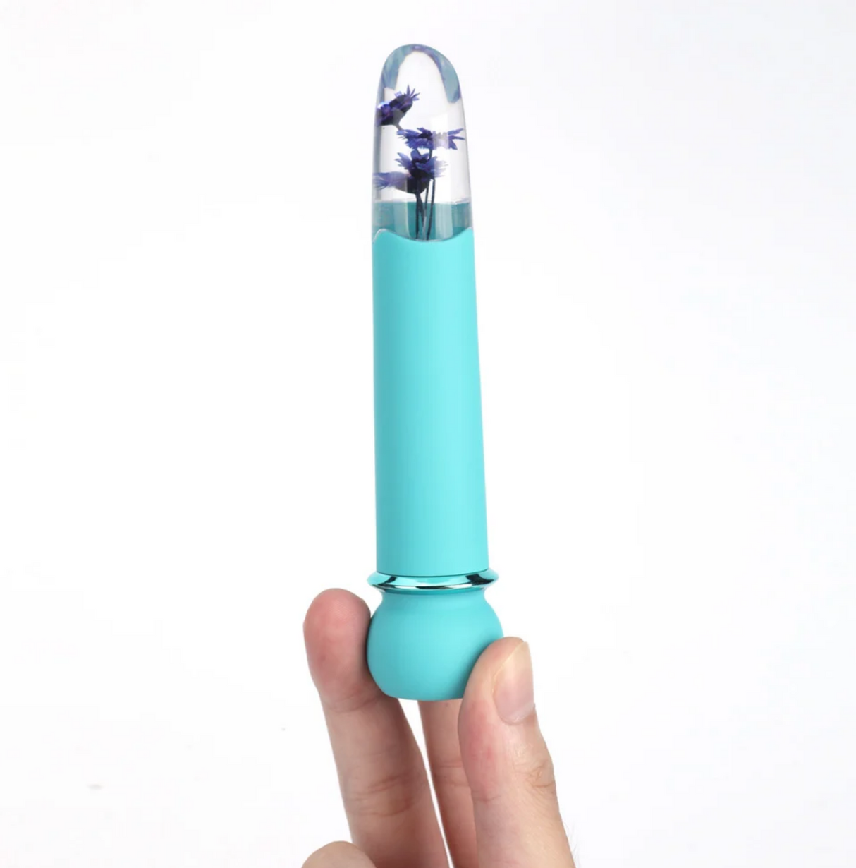 Maia Flora Fiercely Powerful Vibrator Teal held in hand showcasing clear acrylic tip and faux flowers.