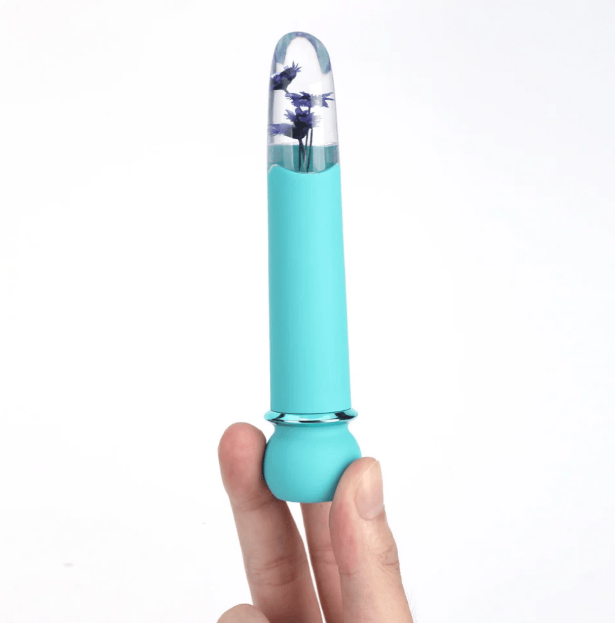Maia Flora Fiercely Powerful Vibrator Teal held in hand showcasing clear acrylic tip and faux flowers.