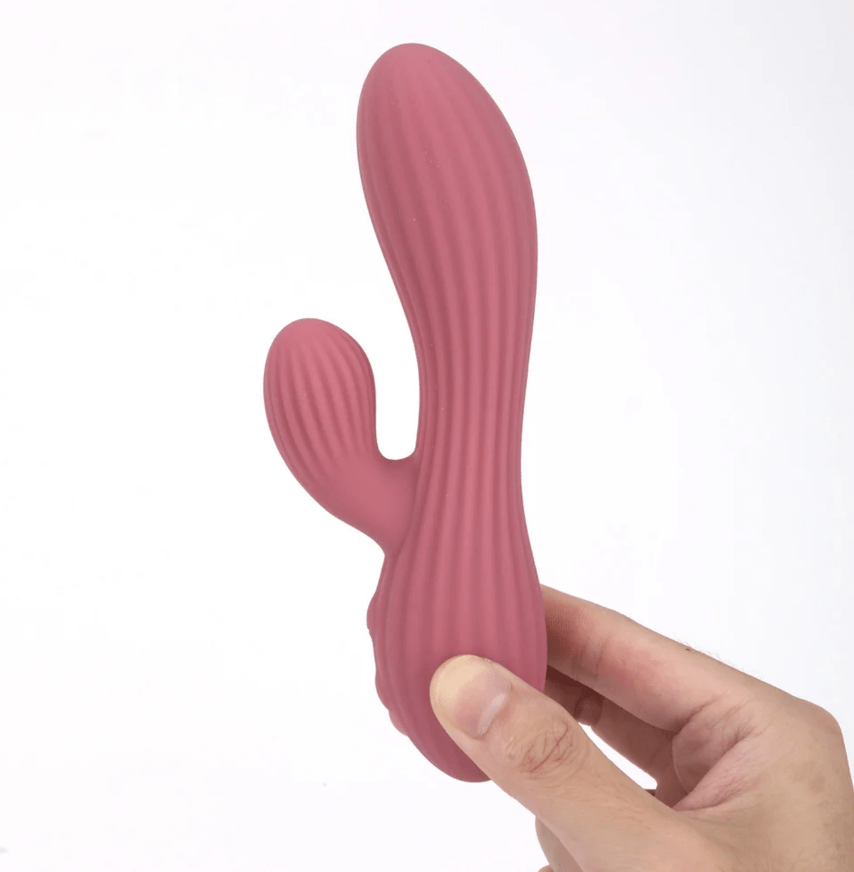 Maia Sedona Liquid Silicone Dual Stimulation Vibrator held in hand showcasing its ergonomic design and texture.