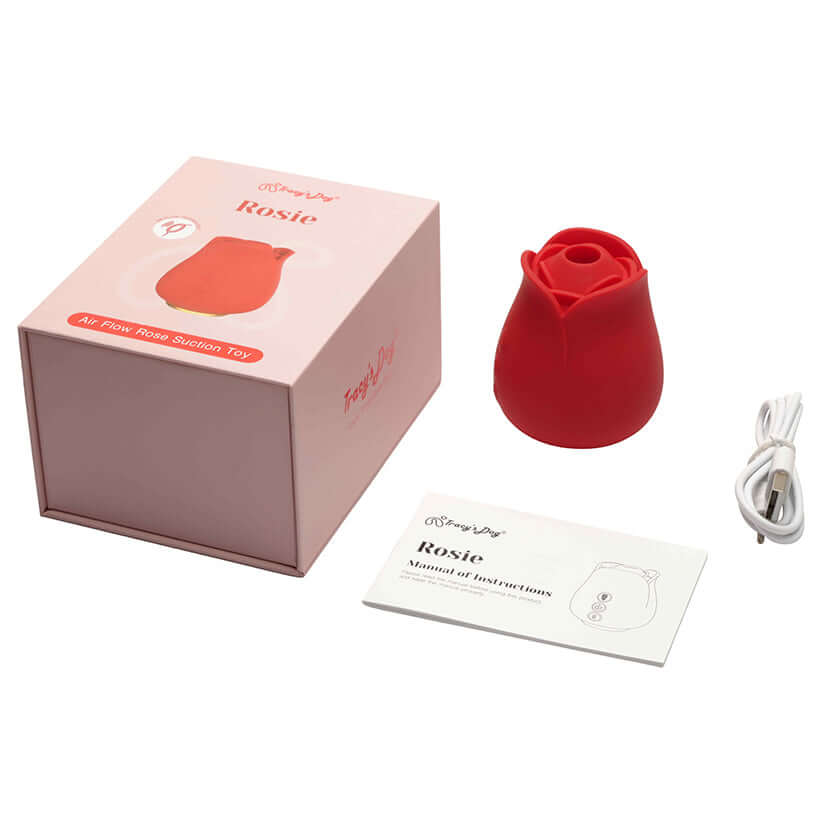 Tracys Dog Rosie Air Suction Massager with box, manual, and charging cable showcasing its elegant rose-inspired design.