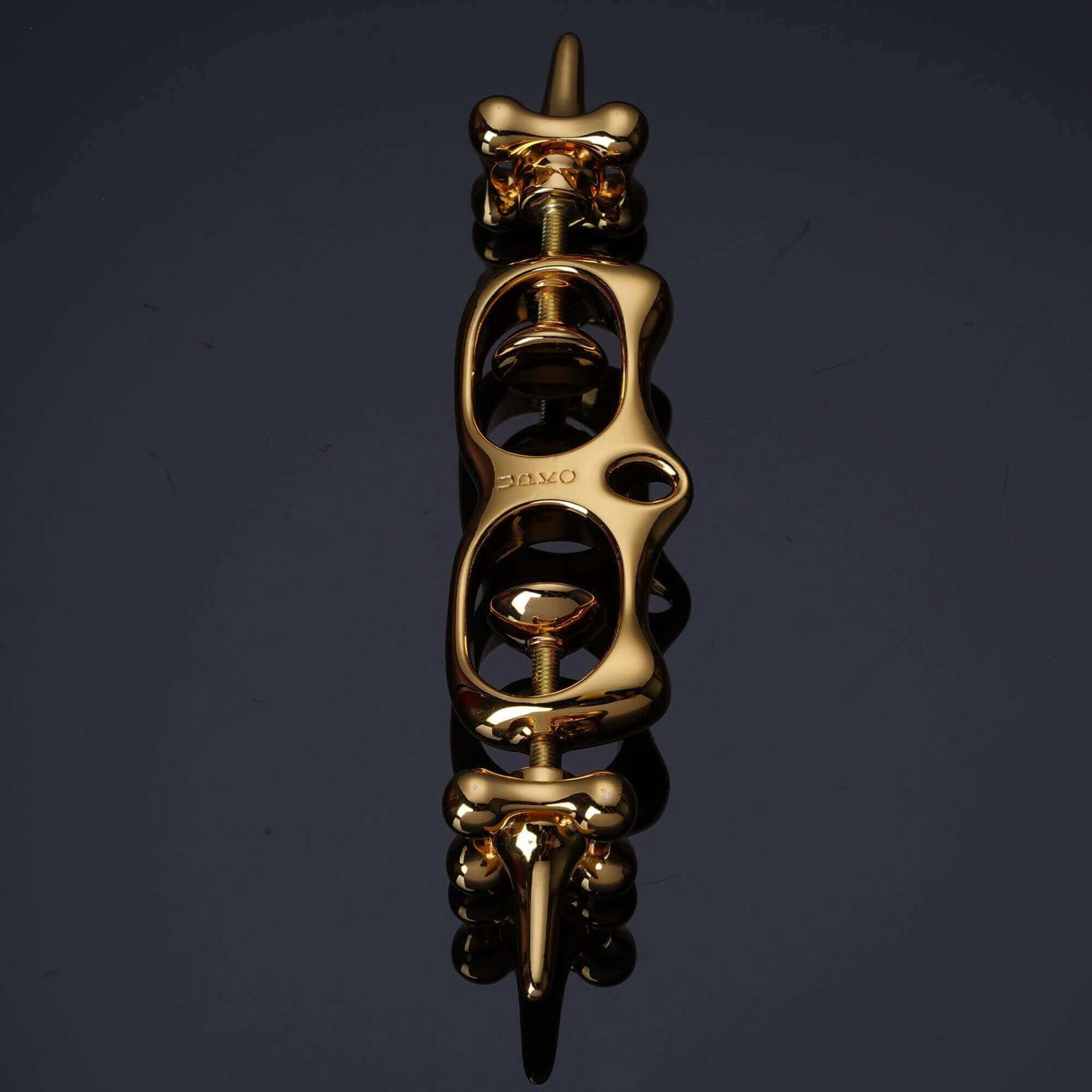 UPKO Thumb Metal Cuffs in gold, featuring a unique design for effective restraint and discipline play.