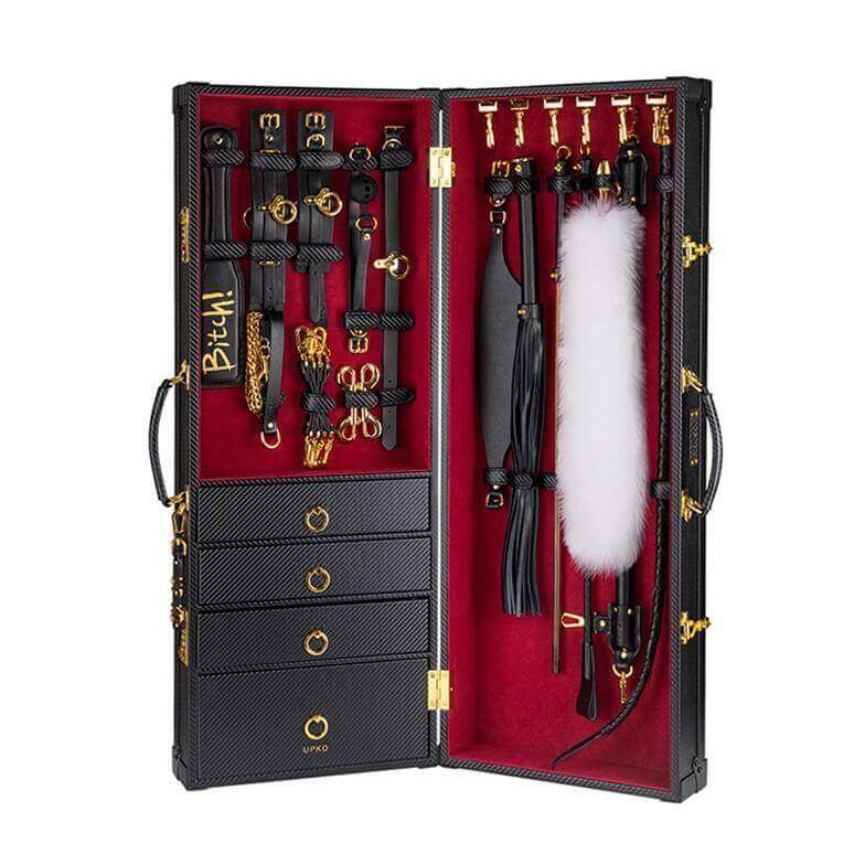UPKO Luxury BDSM 15-piece Sade Trunk Kit showcasing high-quality SM tools in a stylish black and red carbon fiber trunk.