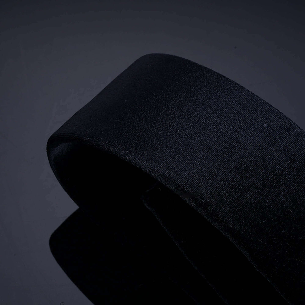 Sleek black fabric strap for bondage restraints, showcasing durable and lightweight design for versatile use.