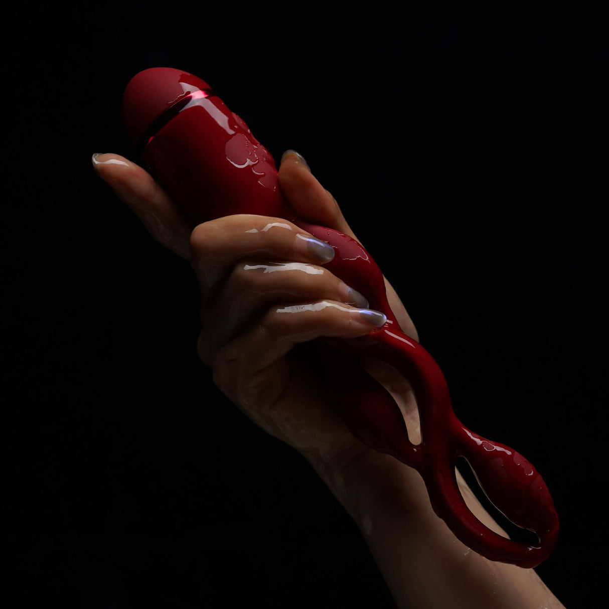 Hand holding UEROS Multi-motor Pulse Vibrator Red with unique design and pulse vibration mode for enhanced sexual experience.