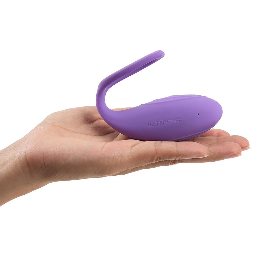 Wet For Her Rockher Vibrator 2.0 Lila in a hand, featuring ergonomic design and remote control for intimate pleasure.