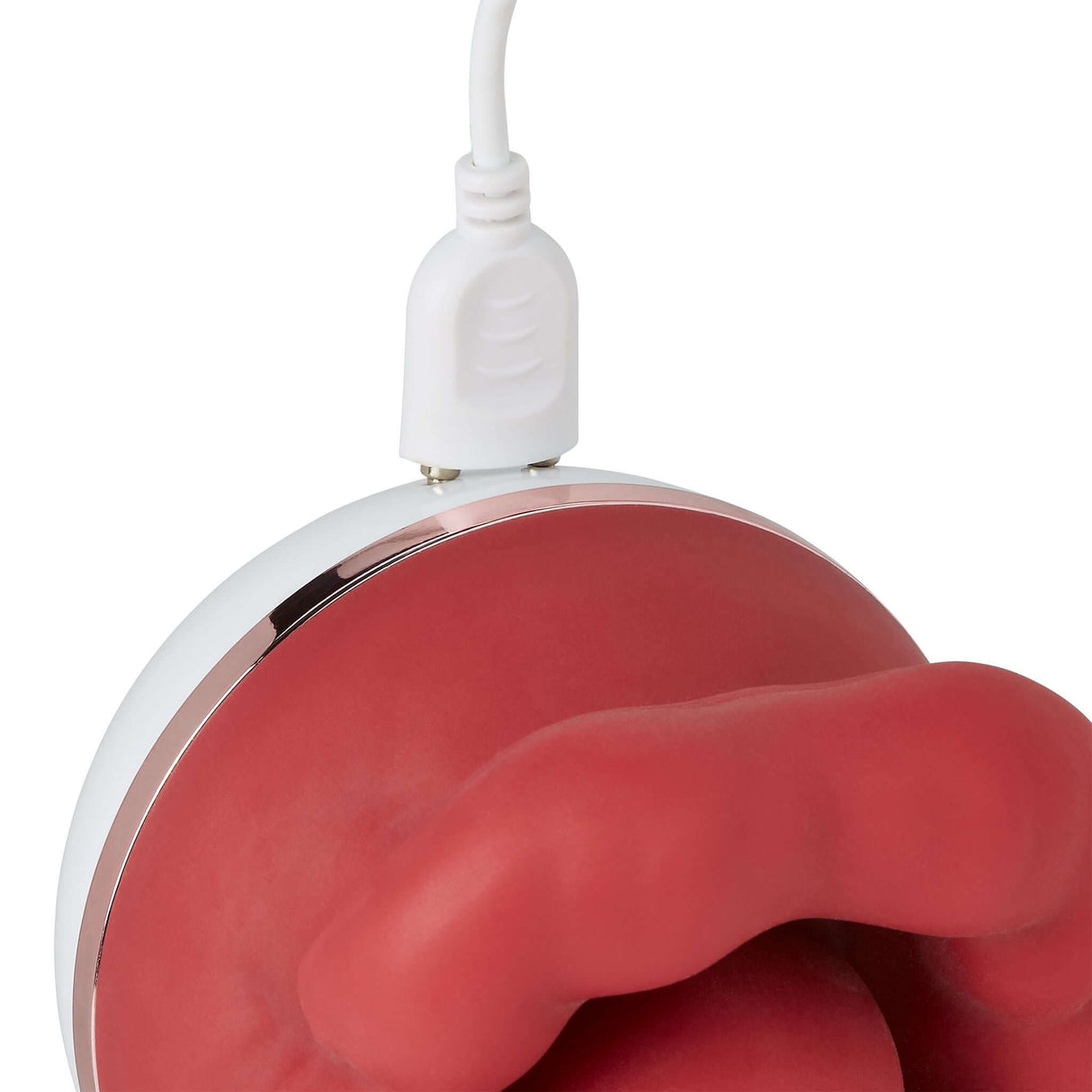 Cloud 9 Big Lips Suction Vibrator charging with a USB cable on a sleek design surface.