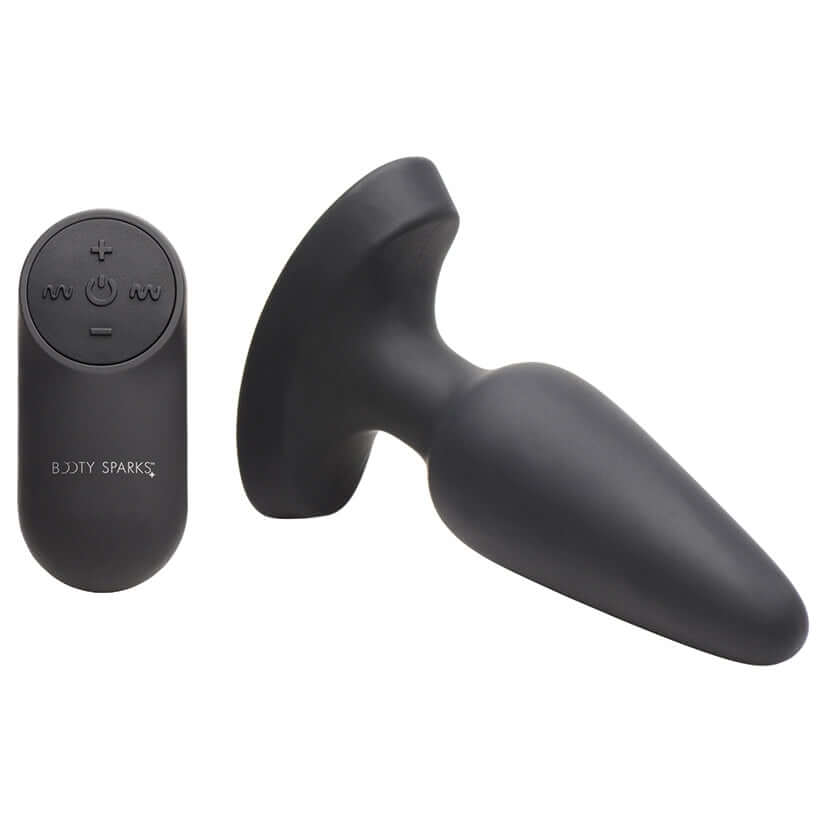 Booty Sparks 28x Laser Heart Silicone Anal Plug With Remote Medium displayed alongside its remote control.