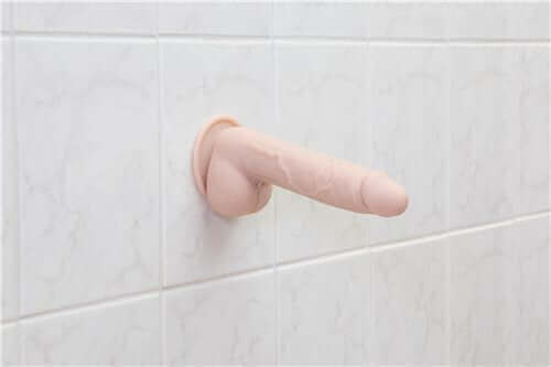 Addiction 100% Silicone Mark realistic dildo 7.5 inches, beige, with suction cup for hands-free play.