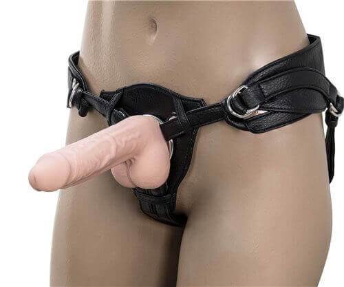 Realistic silicone dildo attached to a harness, ideal for enhancing intimate experiences and pleasure.