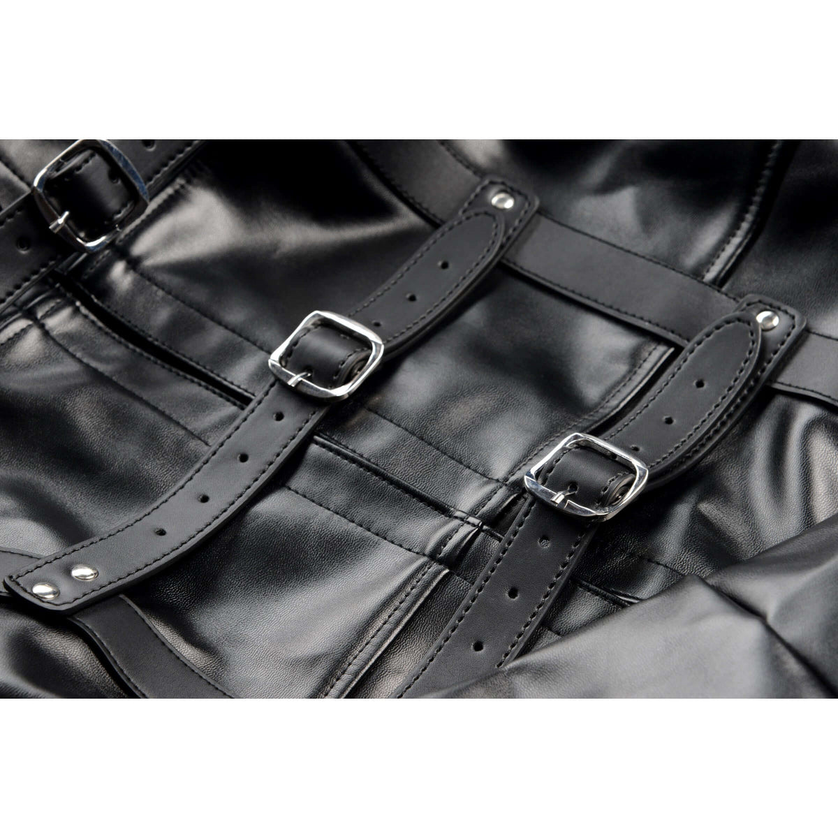 Close-up of STRICT Straight Jacket Medium Faux Leather Black with buckles and straps for restraint.