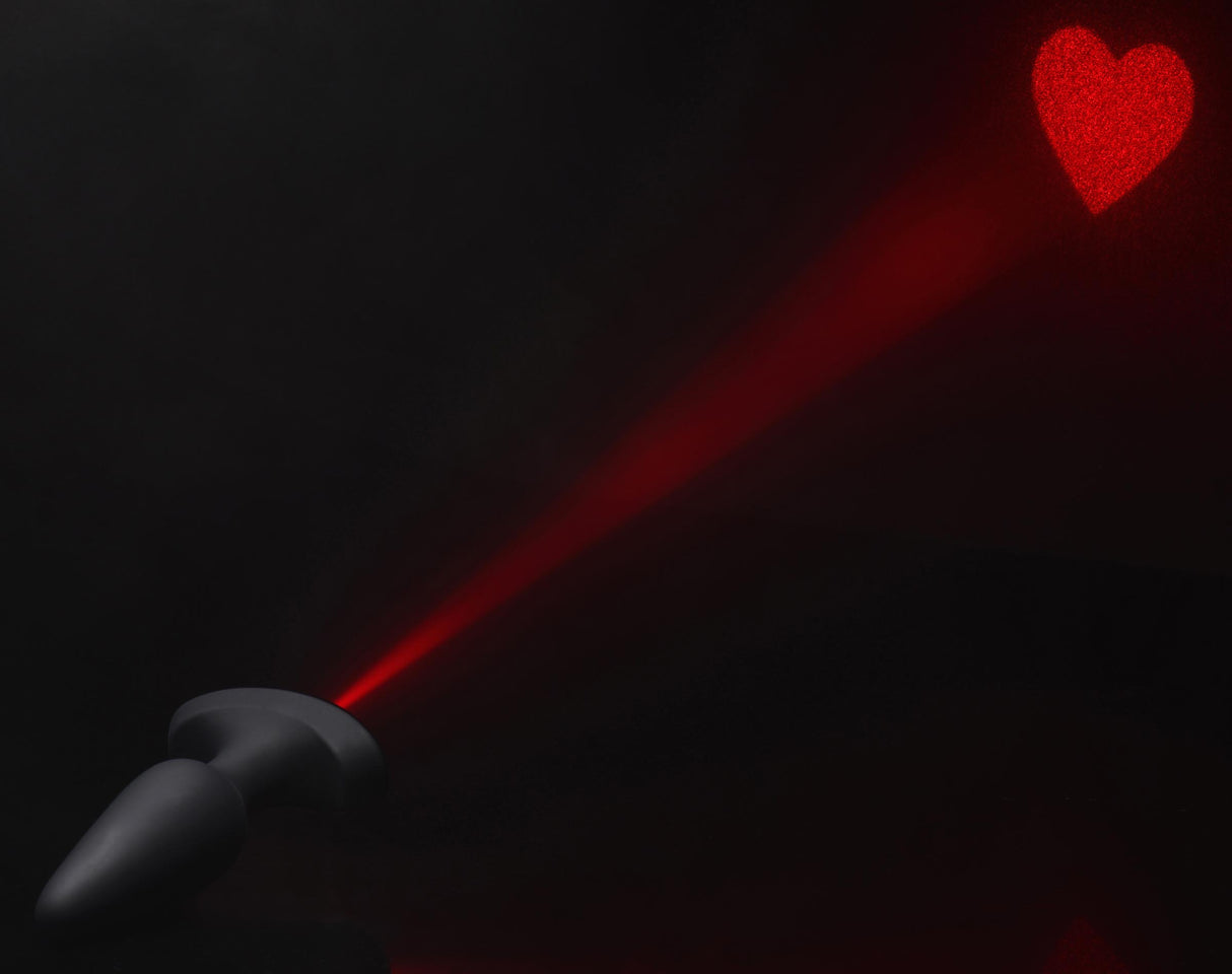 28X Laser Heart Silicone Anal Plug with Remote Large projecting a bright red heart.