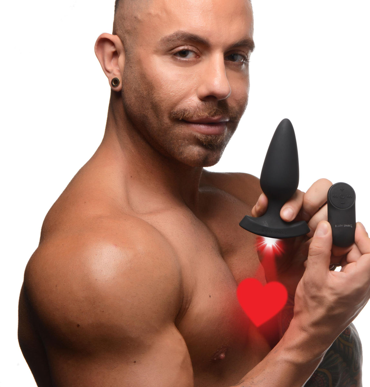 28X Laser Heart Silicone Anal Plug with Remote Large held by a man, showcasing its design and remote control features.