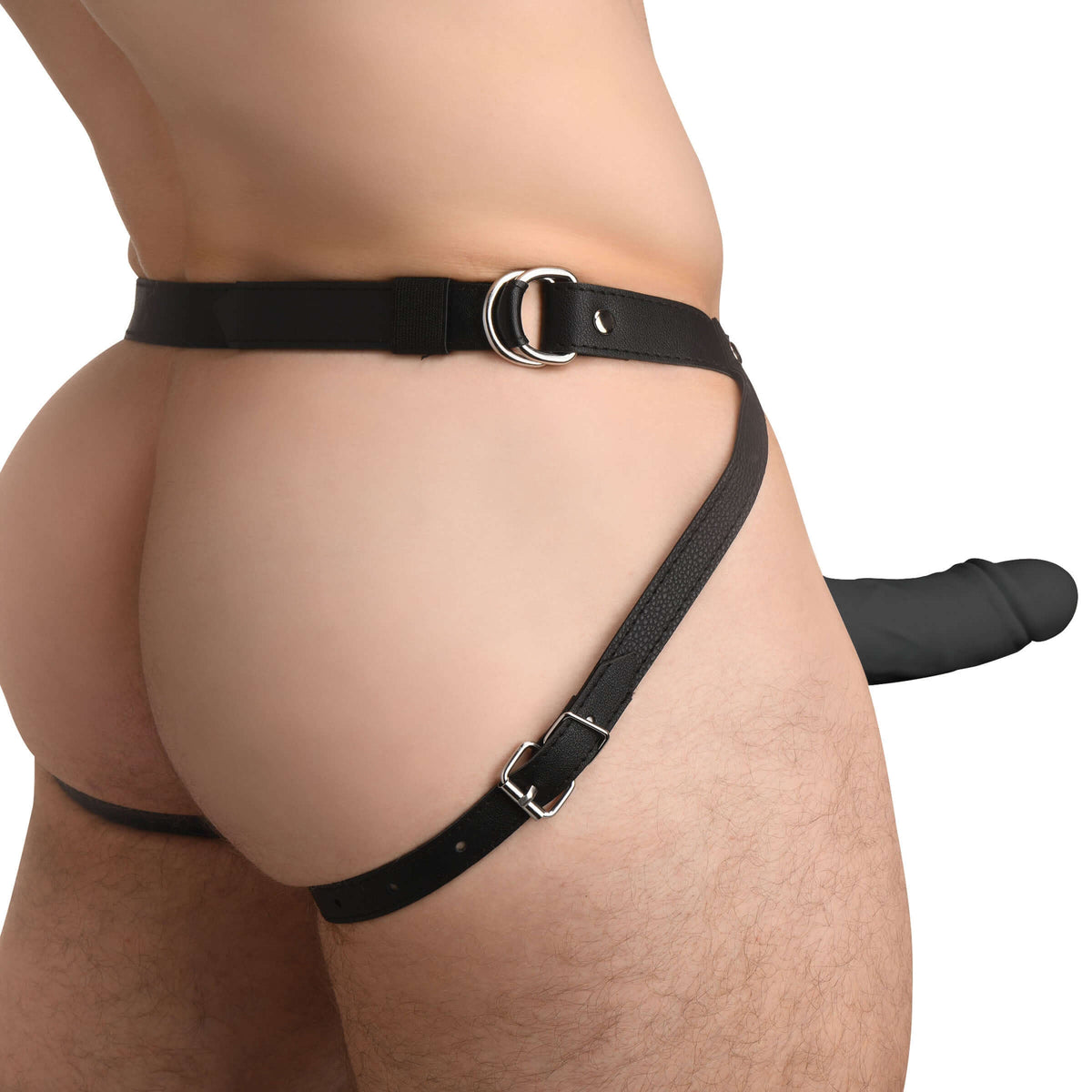 Model wearing a black harness with a dildo, showcasing a realistic design for erotic play.