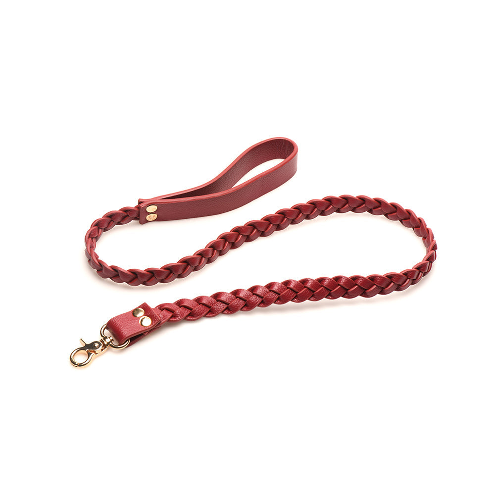 Braided red vegan leather leash with gold clasp, perfect for stylish bedroom restraint adventures.